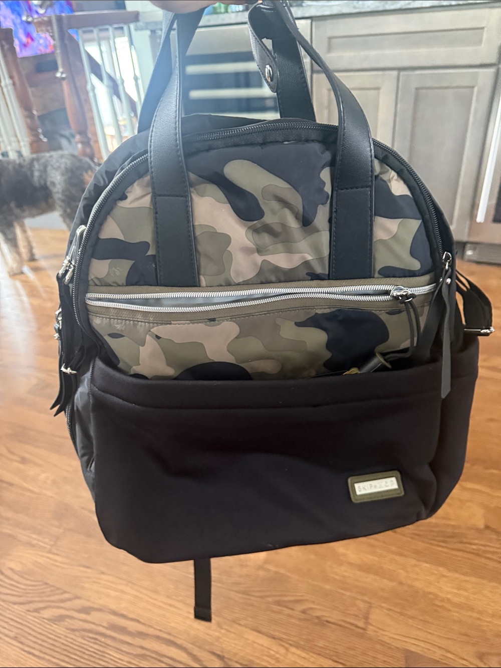 Skip Hop Black Diaper Backpack with Camo Front Pocket and Tassel
